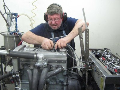 Barry wkg on engine on dyno at PHP REDUCED.jpg and 